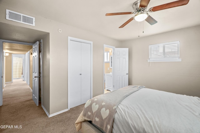 bedroom with carpet, baseboards, visible vents, ceiling fan, and a closet