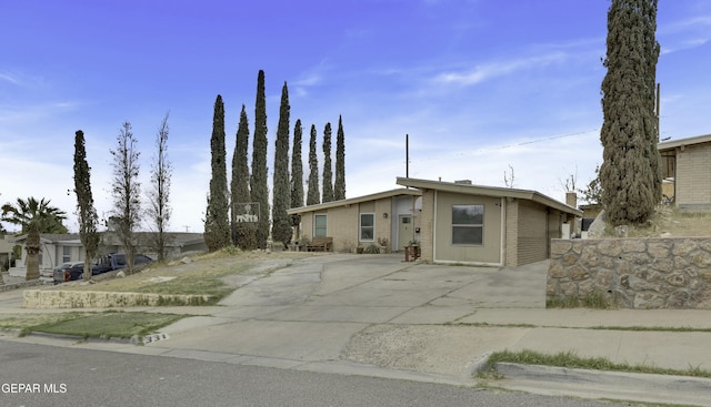 mid-century home with brick siding