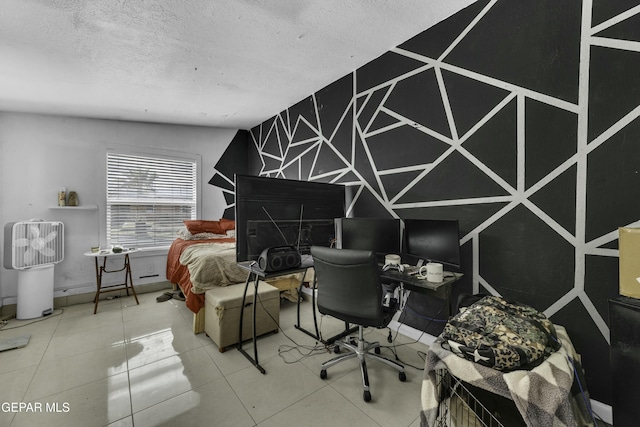 bedroom featuring tile patterned flooring and a textured ceiling