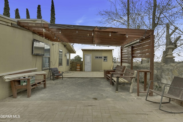 view of patio featuring an outdoor structure