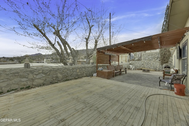 wooden deck featuring an outdoor hangout area