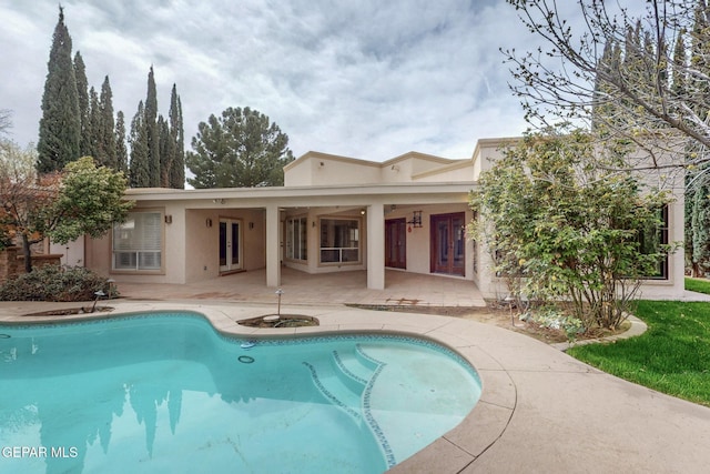 pool featuring a patio and french doors