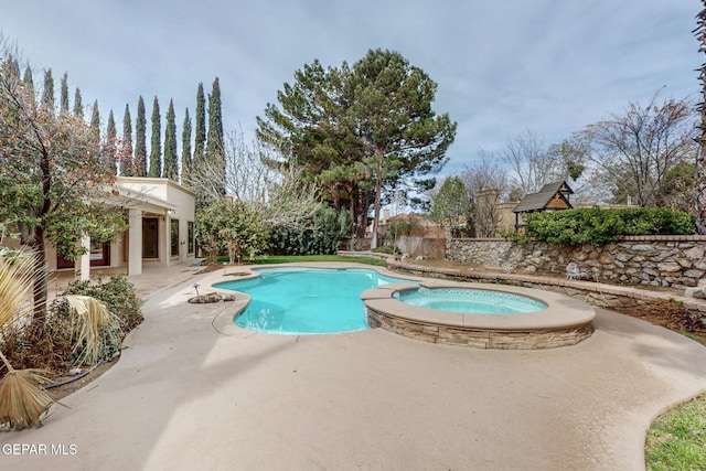 outdoor pool featuring french doors, an in ground hot tub, and a patio area