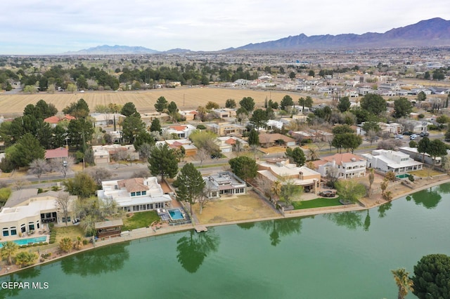 birds eye view of property featuring a residential view and a water and mountain view