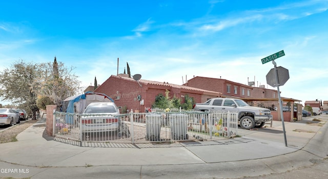 view of front of house featuring fence