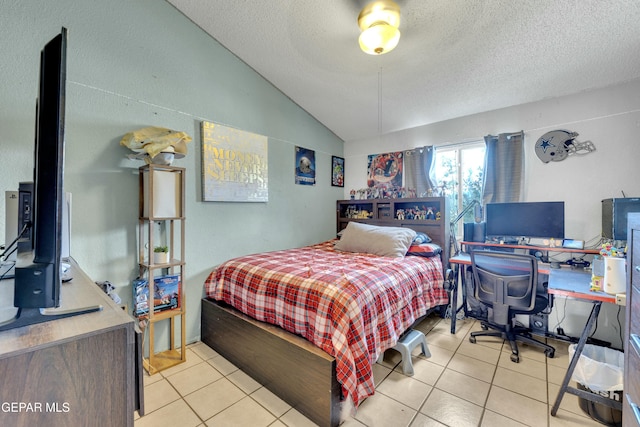 bedroom with light tile patterned floors, a textured ceiling, and vaulted ceiling