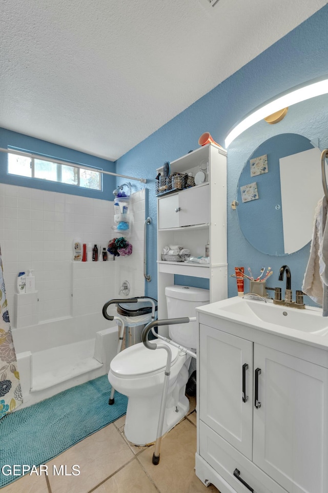 bathroom featuring tile patterned flooring, toilet, vanity, a shower with curtain, and a textured ceiling