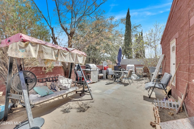 view of patio featuring a fenced backyard and grilling area