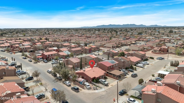 birds eye view of property with a mountain view and a residential view