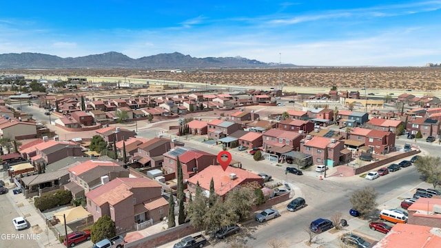 drone / aerial view featuring a residential view and a mountain view