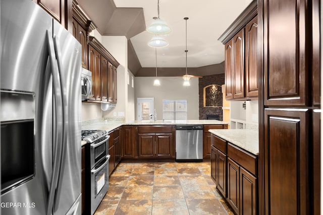 kitchen with dark brown cabinets, a peninsula, hanging light fixtures, stainless steel appliances, and a sink