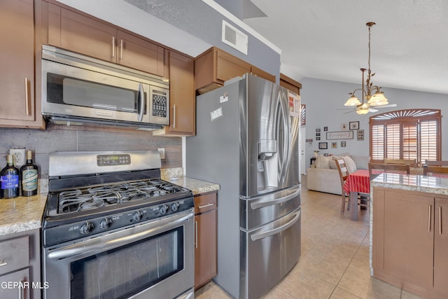 kitchen with light tile patterned floors, visible vents, stainless steel appliances, tasteful backsplash, and a chandelier