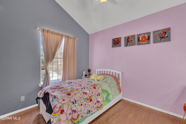 bedroom with vaulted ceiling, wood finished floors, baseboards, and ceiling fan