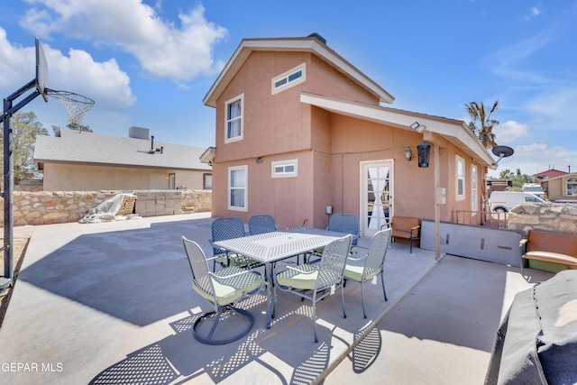 view of patio featuring outdoor dining area and french doors