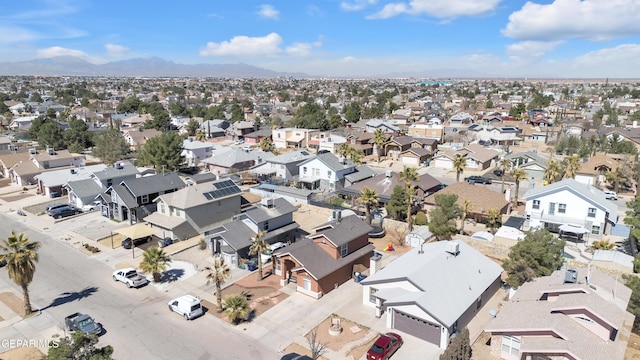 drone / aerial view featuring a residential view and a mountain view