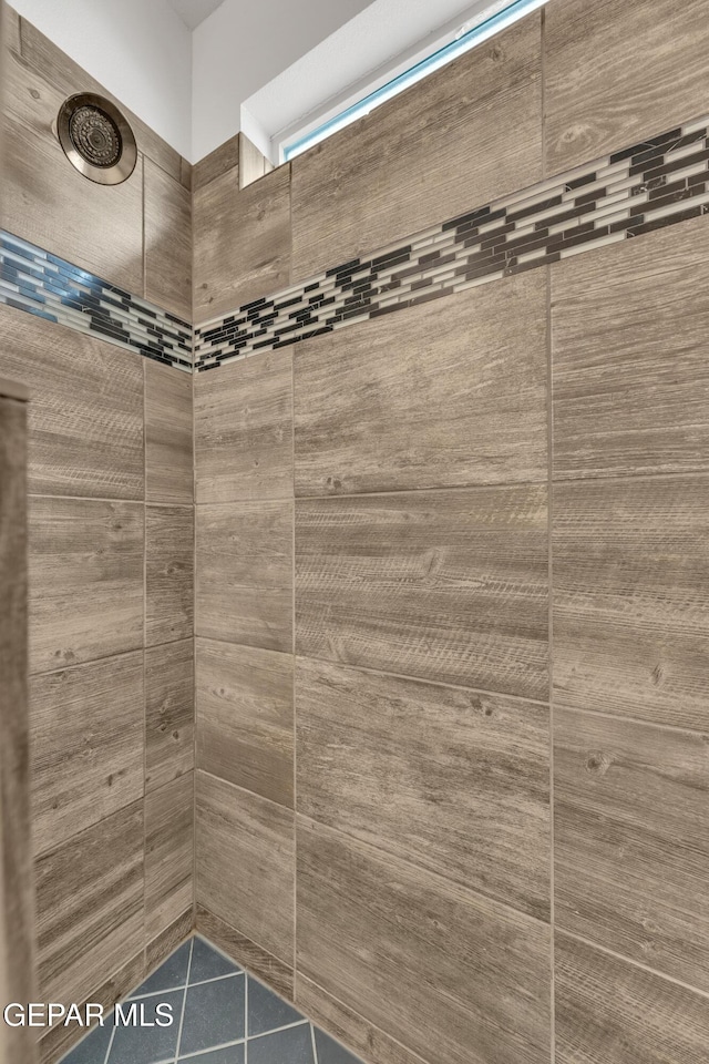 full bathroom with tiled shower