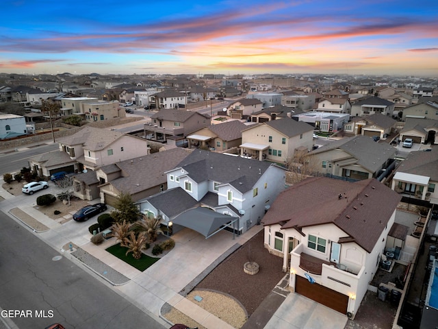 aerial view at dusk with a residential view