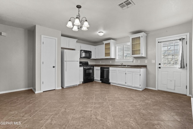 kitchen with visible vents, an inviting chandelier, black appliances, white cabinets, and dark countertops