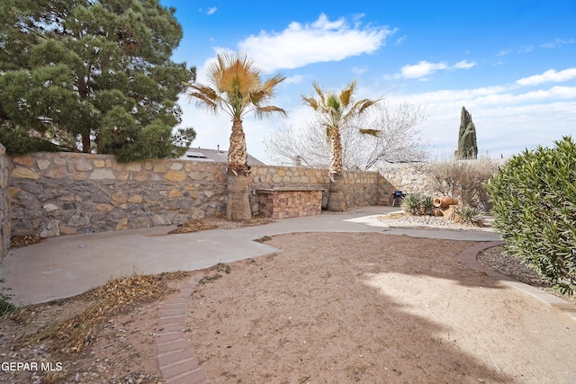 view of yard with a patio and fence