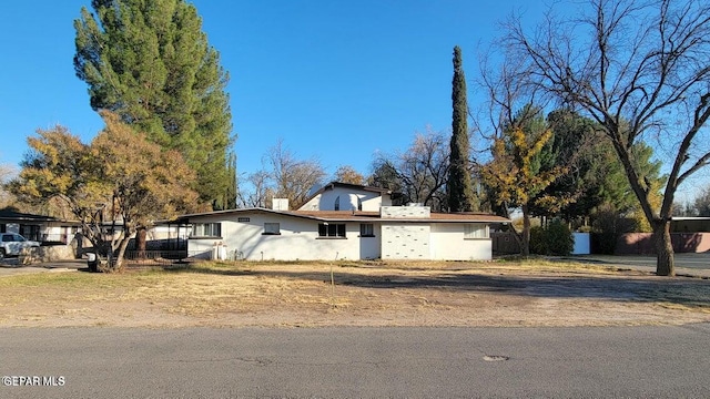 ranch-style house with stucco siding