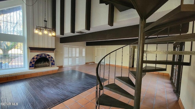 stairway with tile patterned flooring, a healthy amount of sunlight, and visible vents