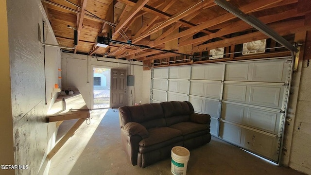 garage with electric panel and a garage door opener