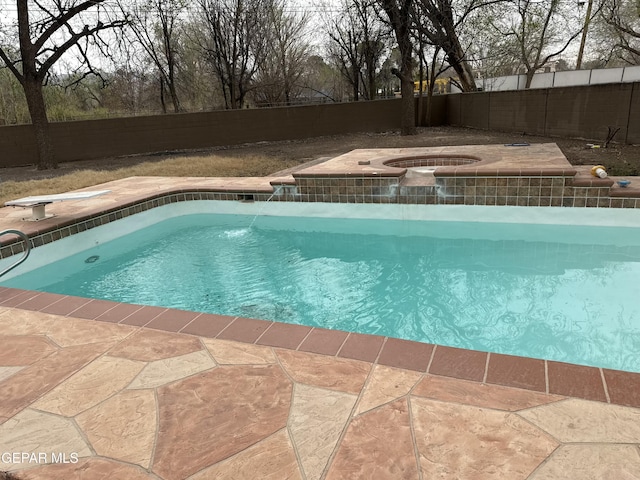 view of pool featuring a fenced in pool, an in ground hot tub, and a fenced backyard