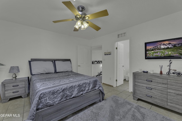 bedroom featuring light tile patterned floors, visible vents, and a ceiling fan