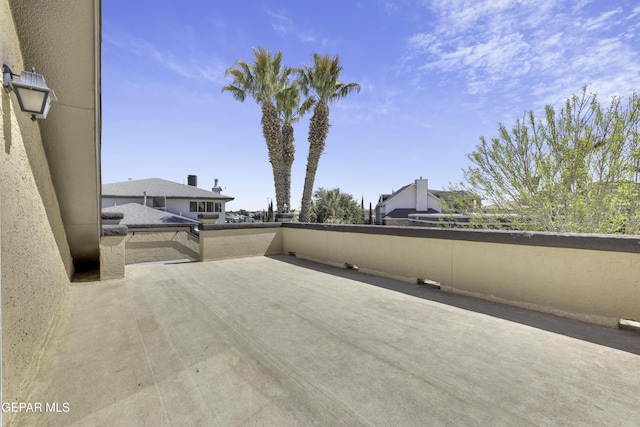 view of patio featuring a balcony