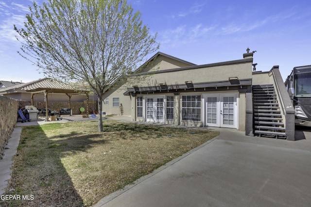 back of house with a patio, stairway, french doors, and stucco siding