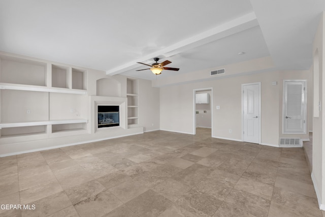 unfurnished living room with visible vents, built in shelves, baseboards, and ceiling fan