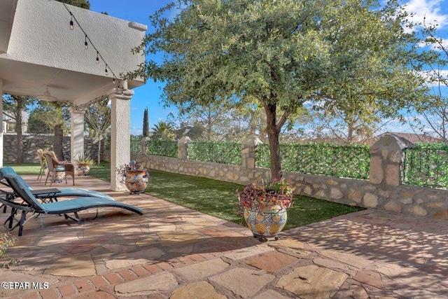 view of patio / terrace featuring fence