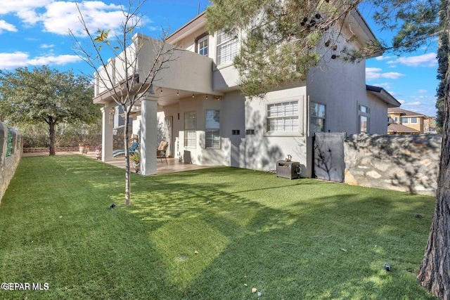 view of yard featuring a patio and a fenced backyard