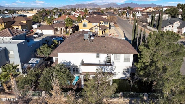 birds eye view of property with a residential view and a mountain view