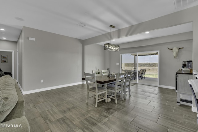 dining room featuring visible vents, recessed lighting, baseboards, and wood tiled floor