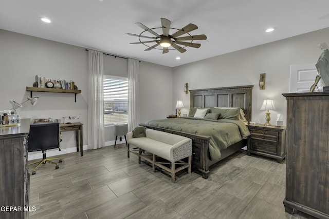 bedroom featuring a ceiling fan, recessed lighting, baseboards, and wood finish floors