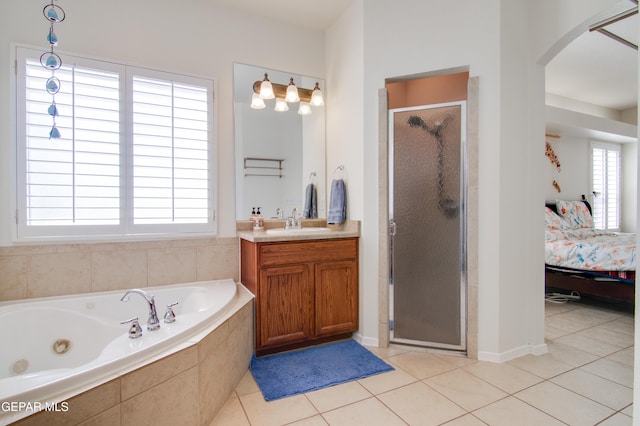 ensuite bathroom with vanity, ensuite bath, a stall shower, tile patterned floors, and a jetted tub