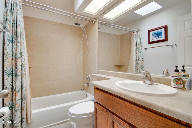 full bathroom with toilet, vanity, a skylight, and shower / tub combo