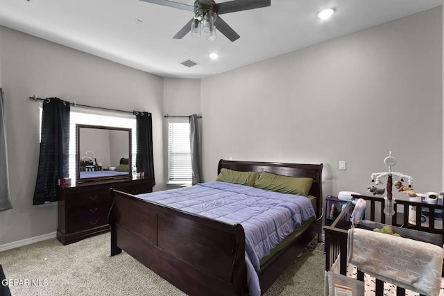 bedroom with a ceiling fan, baseboards, visible vents, recessed lighting, and light carpet