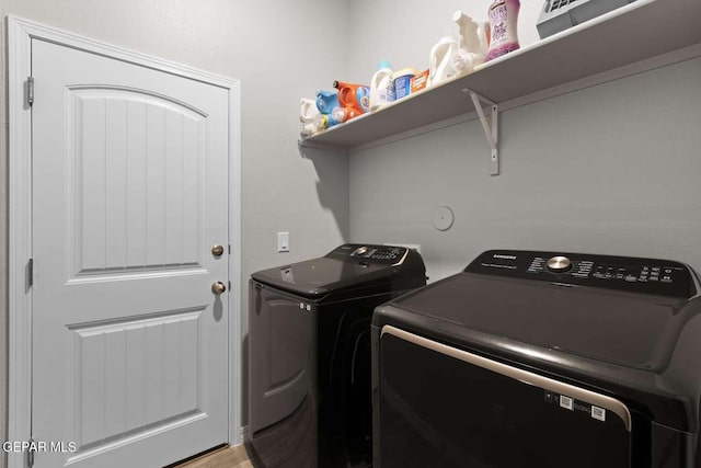 laundry room with separate washer and dryer and laundry area