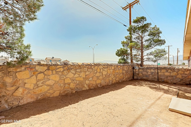 view of patio / terrace featuring fence