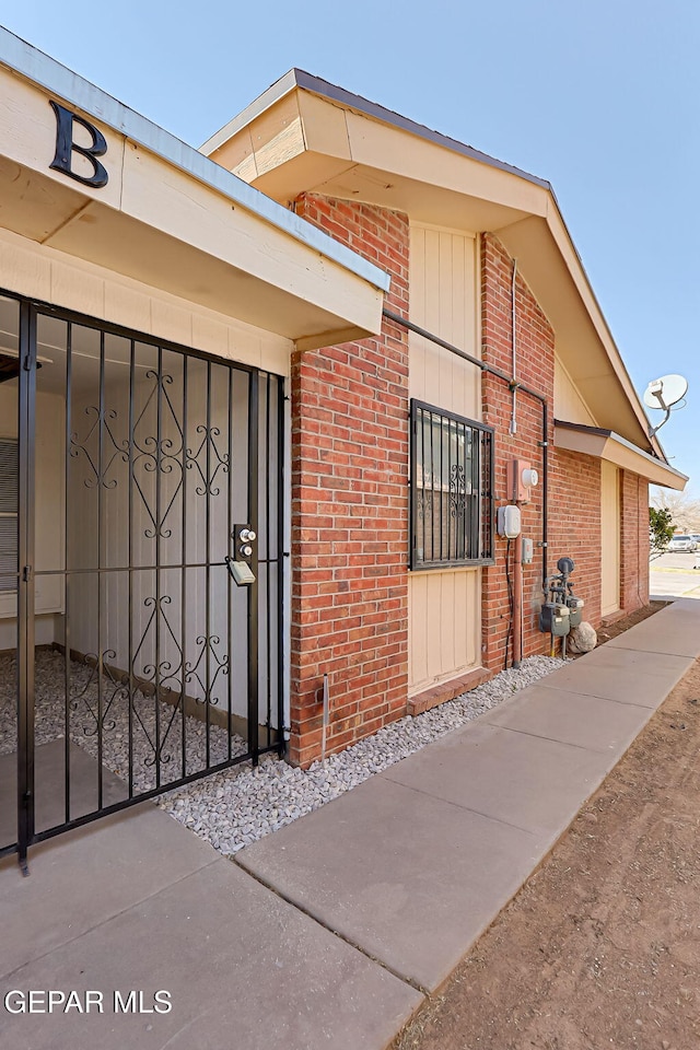 property entrance with brick siding