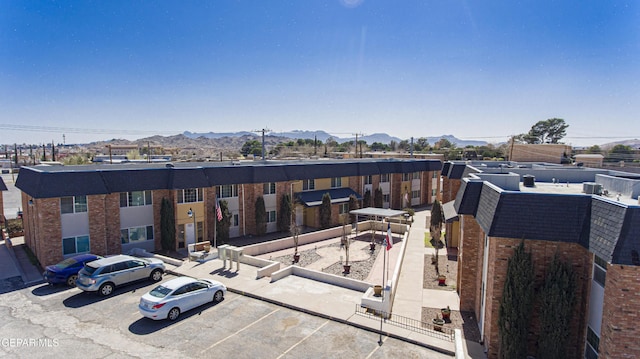 birds eye view of property with a mountain view