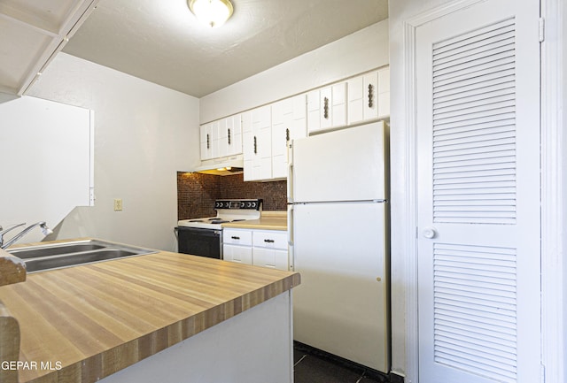 kitchen featuring tasteful backsplash, under cabinet range hood, white cabinets, white appliances, and a sink