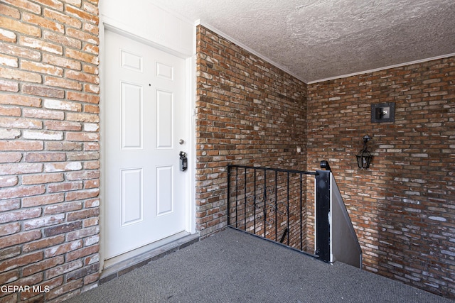 property entrance with brick siding