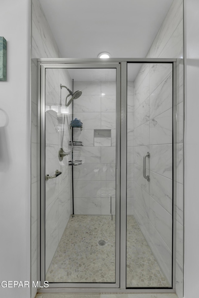 bathroom featuring a stall shower