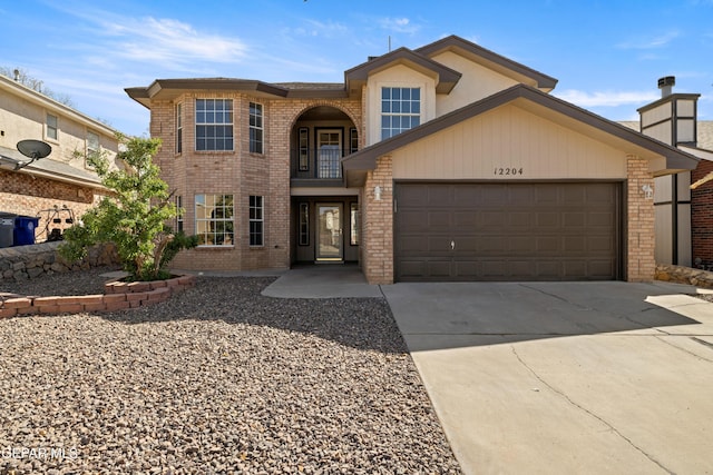 traditional home with concrete driveway, a balcony, an attached garage, and brick siding