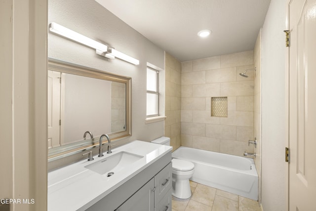 full bath featuring vanity, tile patterned floors, toilet, and shower / washtub combination