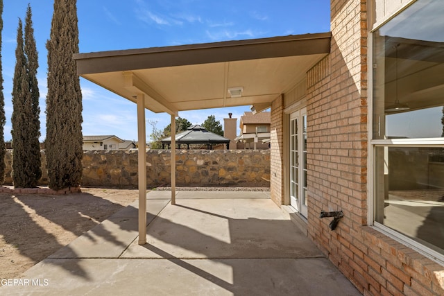 view of patio featuring fence