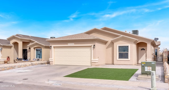 ranch-style house featuring central AC, an attached garage, driveway, and stucco siding